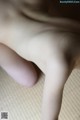 A close up of a person's hand on a table.